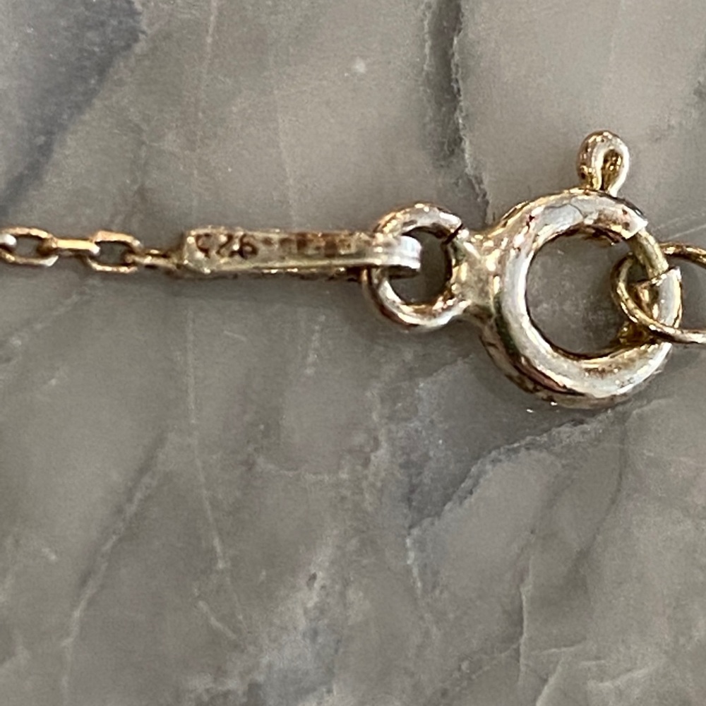 Motherof pearl hamsa necklace.  Gold plated